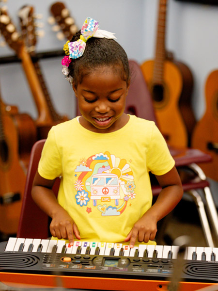 Child playing piano