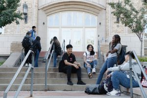 DPS Students sitting on steps laughing